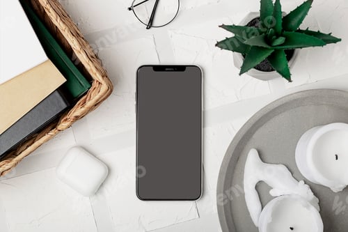 Preview: Smartphone screen mockup on stylish cozy home office workplace. Modern desktop. Top view.
