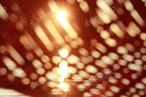 Preview: Golden sunlight through holes of wooden sunshade