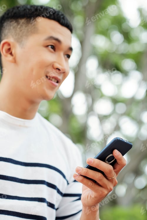 Preview: Man using his mobile phone