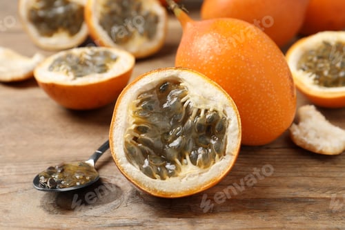 Preview: Delicious ripe granadillas on wooden table, closeup