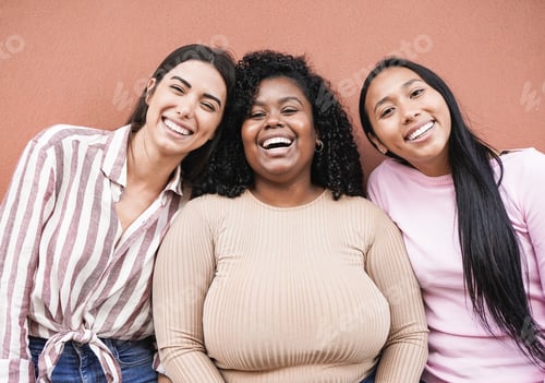 Preview: Happy latin women with different skin color looking in camera