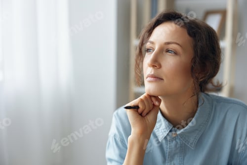 Vista previa: Portrait of pensive thoughtful dreaming curly adorable businesswoman looks aside pondering about