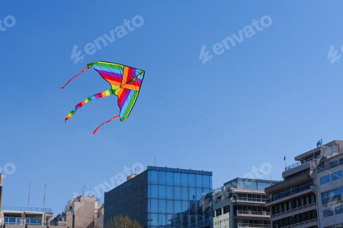 Preview: Colorful kite soars high in the sky Blue sky. Sports kite festival.