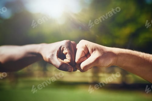 Preview: I got you, bro. Cropped shot of two men bumping fists.