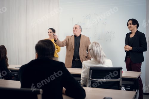 Preview: Portrait of a senior businessman giving a presentation to his colleague at office