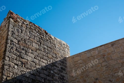 Preview: Traditional village stoned house wall against blue clear sky, Traditional village architecture