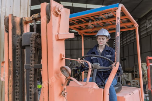 Preview: WoMan worker at forklift driver happy working in industry factory logistic ship.