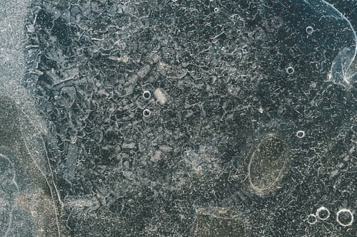 Preview: Abstract Surface Of Ice Of Dirty-Green Color With Bubbles And With Scratches
