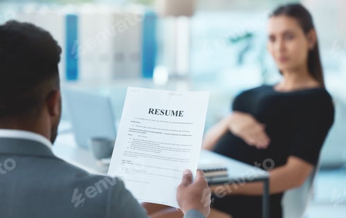 Preview: Shot of an unrecognisable businessman handing over his resume to a recruiter during a job interview