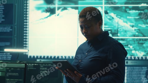 Preview: Governmental hackers working on computer network in high tech office