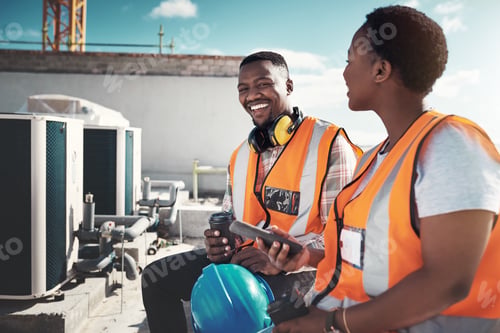 Preview: Shot of a young man and woman having a coffee break at a construction site