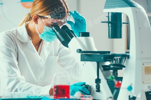Preview: Biotechnology. Female scientist working in laboratory