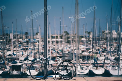 Preview: Rusty bicycle with container box on a quay outdoors