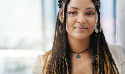 Preview: Cropped portrait of an attractive young female designer standing in her office