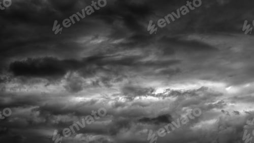 Preview: Stormy sky with dark fluffy clouds. Dramatic moody sky.