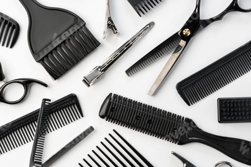 Preview: Black hairdressing tools and various hairbrushes on white background