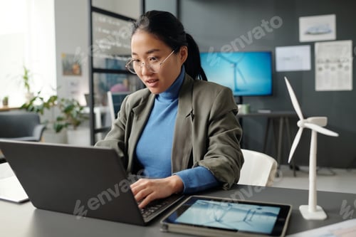 Preview: Woman analyzing online data and typing