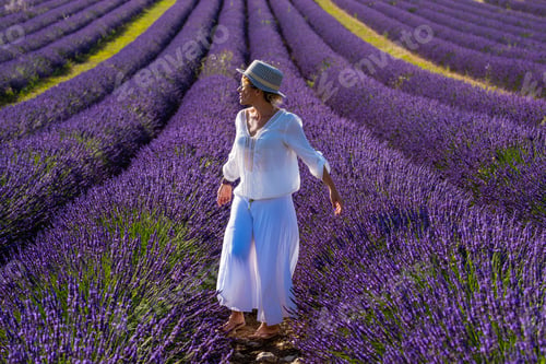 Preview: Portrait of beautiful fashion woman in lavender fields visiting valensole provence france