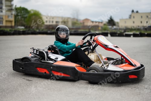 Preview: Go-Kart Racing Action With Focused Driver In Black Helmet