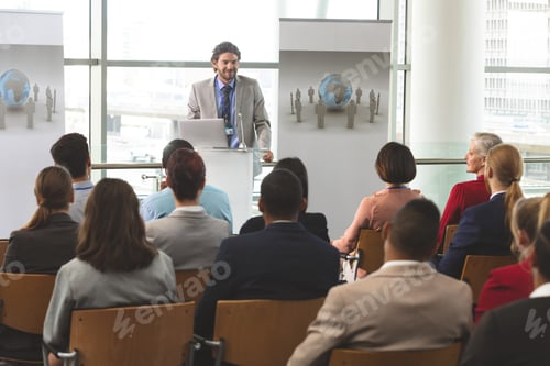 Preview: Businessman with laptop speaks at business seminar