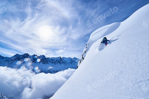 Preview: Woman skiing down steep mountainside in Swiss Alps, Gstaad, Switzerland