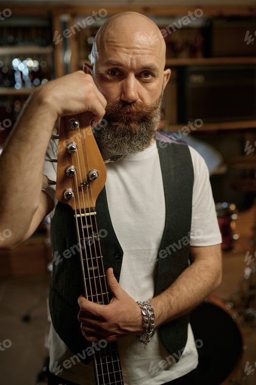 Preview: Portrait of rock band guitarist with his music instrument