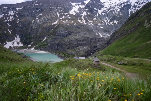 Preview: Solitary chapel near the emerald green Margaritze stausee lake on the Grossglockner High Alpine Road