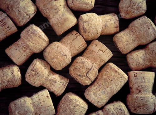 Preview: Dated wine bottle corks on the wooden background