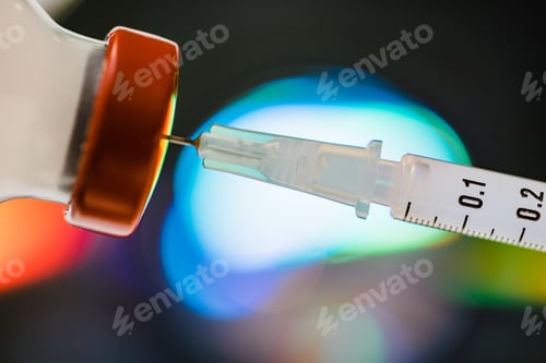 Preview: Vaccine concept, syringe pulling up soliton from a vial with red top