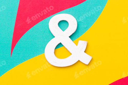 Preview: Letter & of the alphabet on colored background, top view