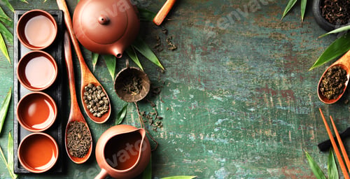 Preview: Assorted Loose Leaf Teas with Clay Teapot and Teacups on Rustic Surface