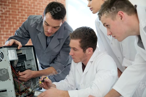 Preview: Students In Computing Class With Teacher Fixing Hardware