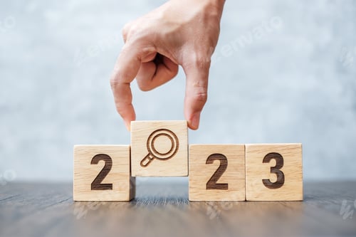 Preview: 2023 block with magnifying glass icon.