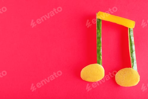 Preview: Musical note made of vegetables and fruits on color background, top view. Space for text