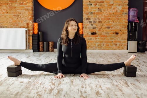 Preview: Young woman practicing yoga and fly yoga concept