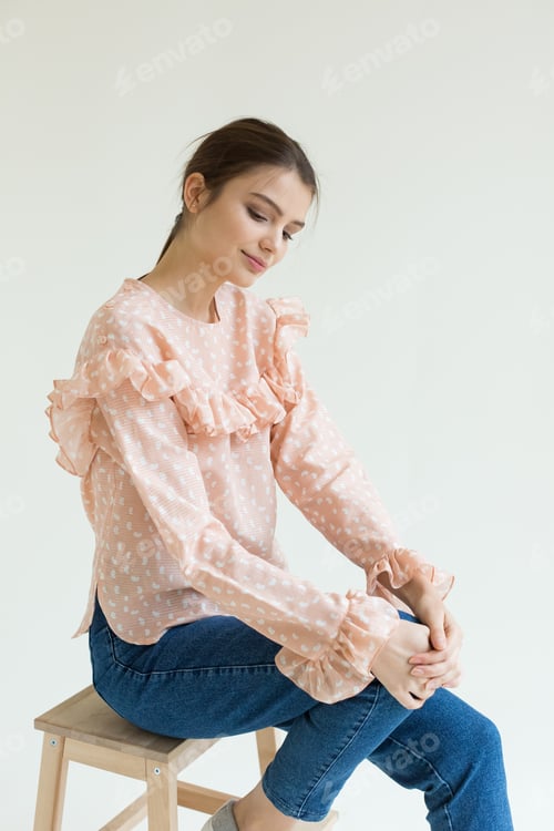 Preview: Young beautiful stylish woman in studio in coat, autumn fashion trend.