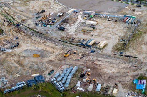 Preview: Construction site with building equipment on prepared ground in american suburbs.