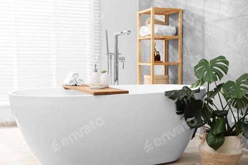 Preview: Different personal care products on bath tub in bathroom