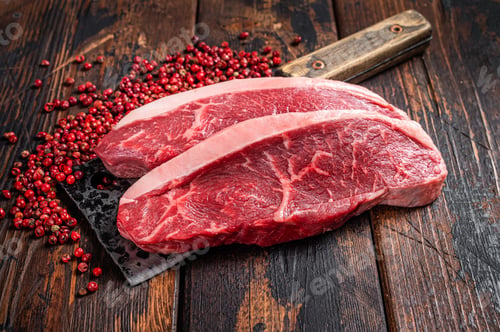 Preview: Top sirloin beef steak or brazilian Picanha, raw meat on butcher cleaver.