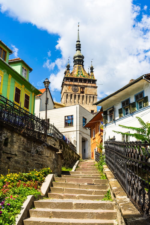 Preview: Clock tower surrounded by buildings in Sighisoara