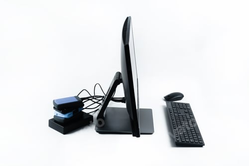 Preview: Multiple external hard drives connected to a monoblock on a white background.Computer with hard