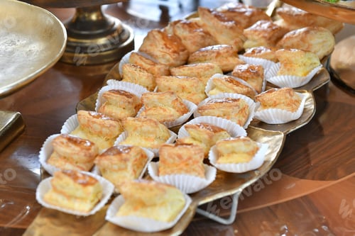 Preview: Closeup of fresh pastries arranged on a tray for a banquet
