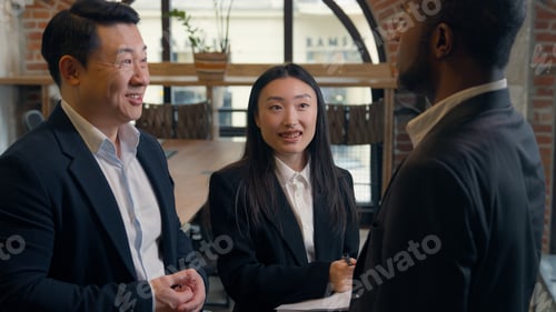 Preview: Three multiracial business people in office teamwork meeting Asian man Korean businessman boss