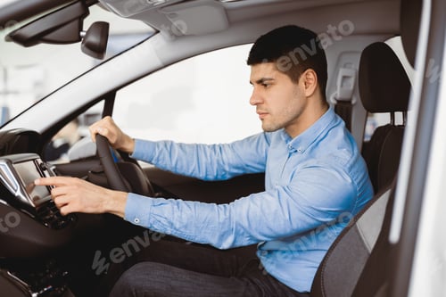 Preview: Businessman Sitting In New Auto Checking Navigation System