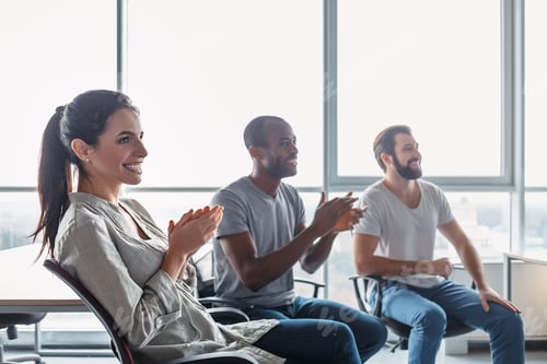 Preview: Young professional team discussing business plan in the office