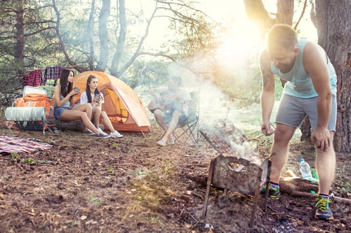 Preview: Party, camping of men and women group at forest. They relaxing, singing a song and cooking barbecue