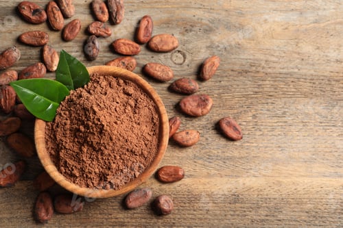 Preview: Bowl with cocoa powder on wooden table, top view. Space for text