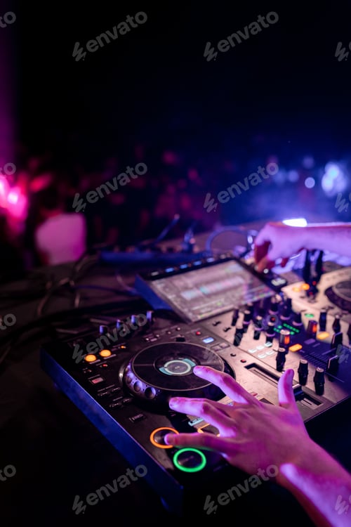 Preview: Hands of DJ performing in stage in a disco
