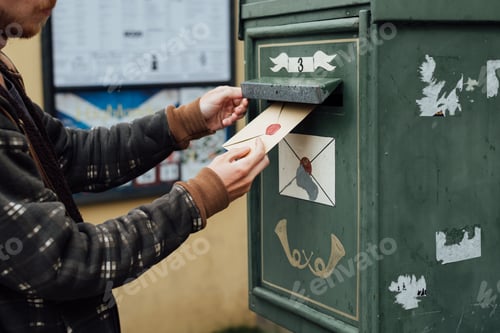 Preview: Posting letter to old postbox on street