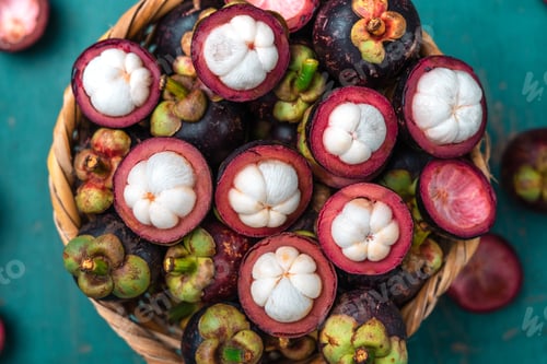 Preview: Mangosteen fruit on light blue wooden background,Tropical fruit